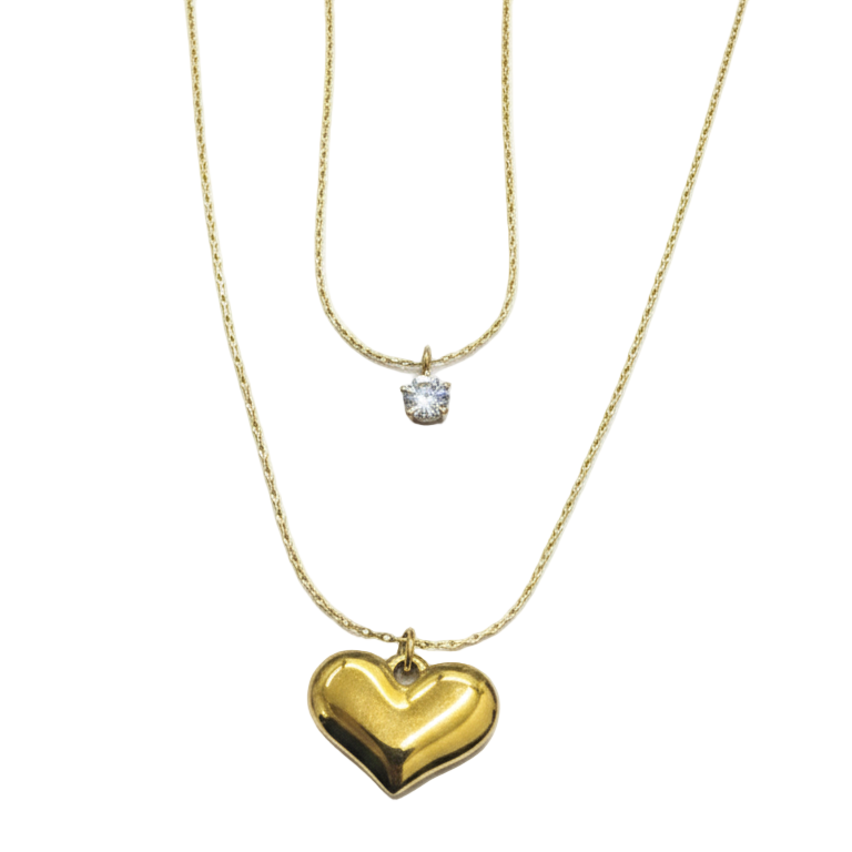 Gold heart-shaped pendant necklace with a diamond on a white background
