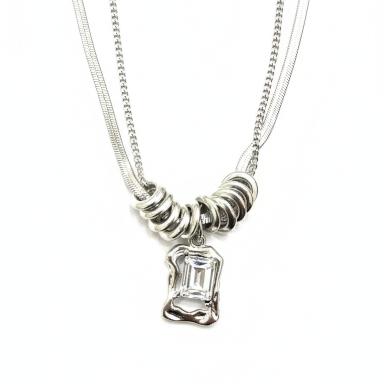 Silver necklace with a pendant on a white background